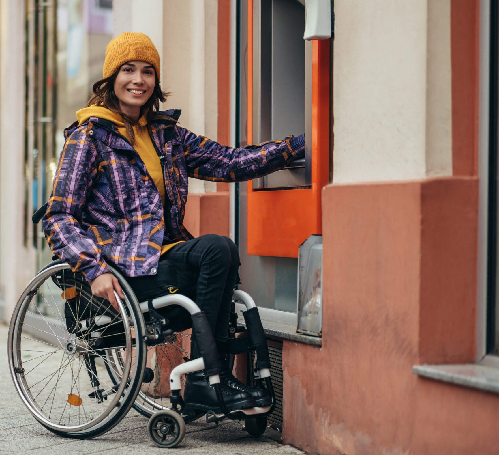 woman with disability using credit card and atm ma 2023 11 27 04 55 06 utc scaled e1710779271839